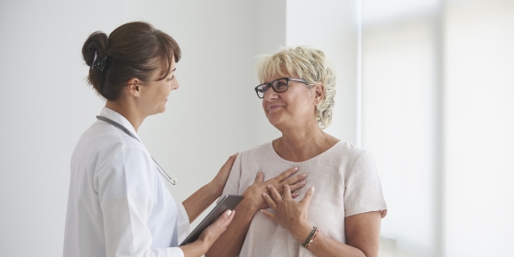 Female doctor delivering good news to patient