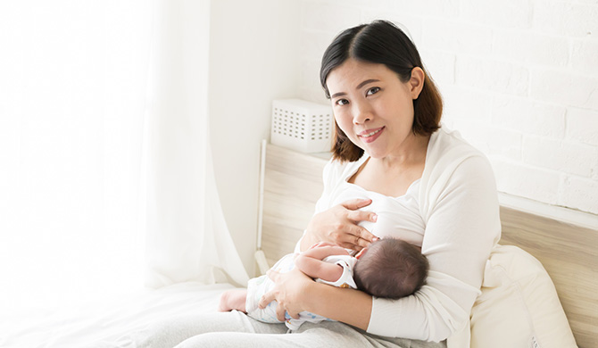 Mother breastfeeding baby